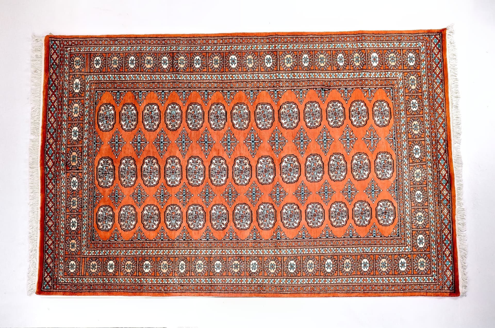 Pakistani Rust Orange Bukhara — Elephant's Foot — photograph